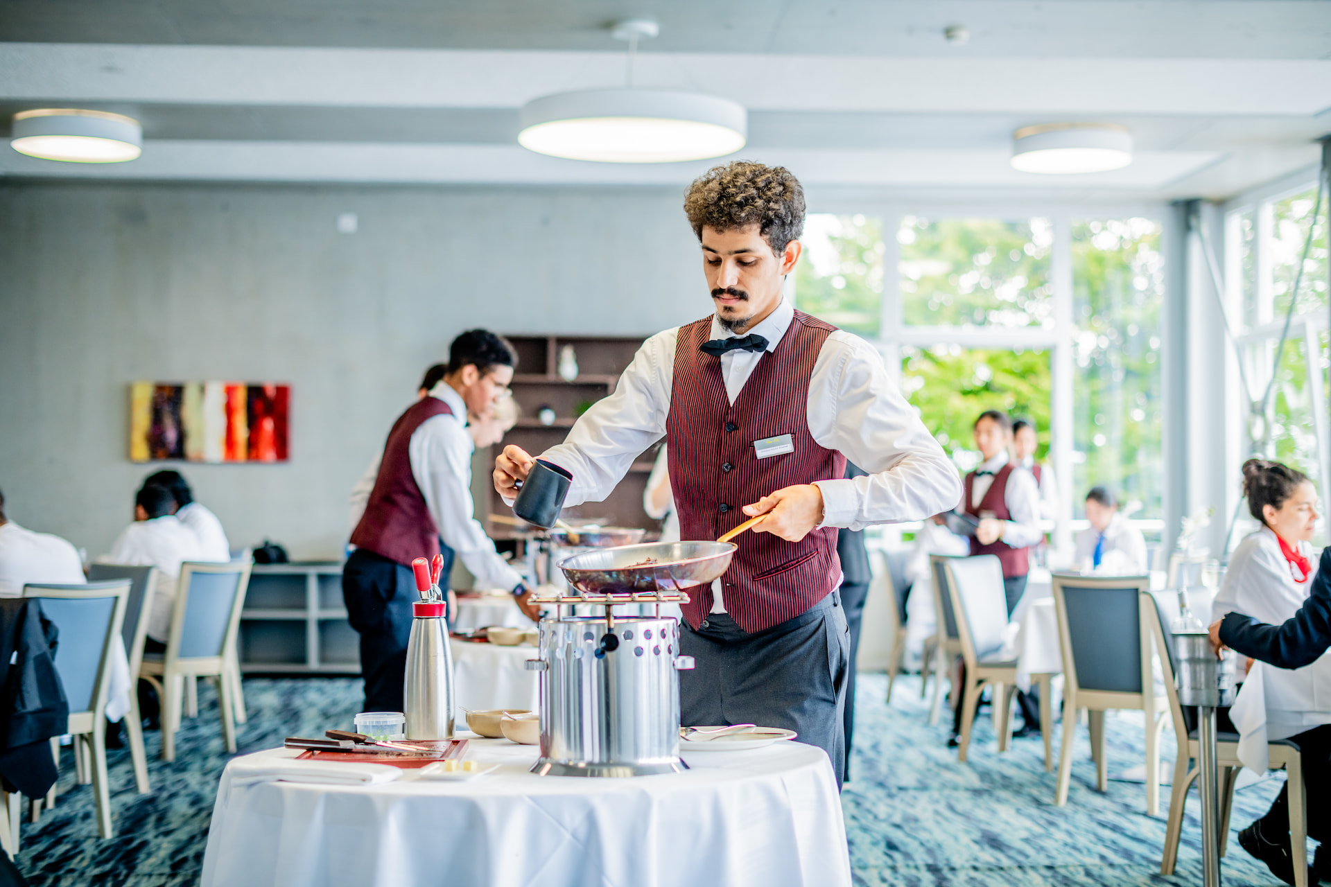 Hotel waiter cooking food